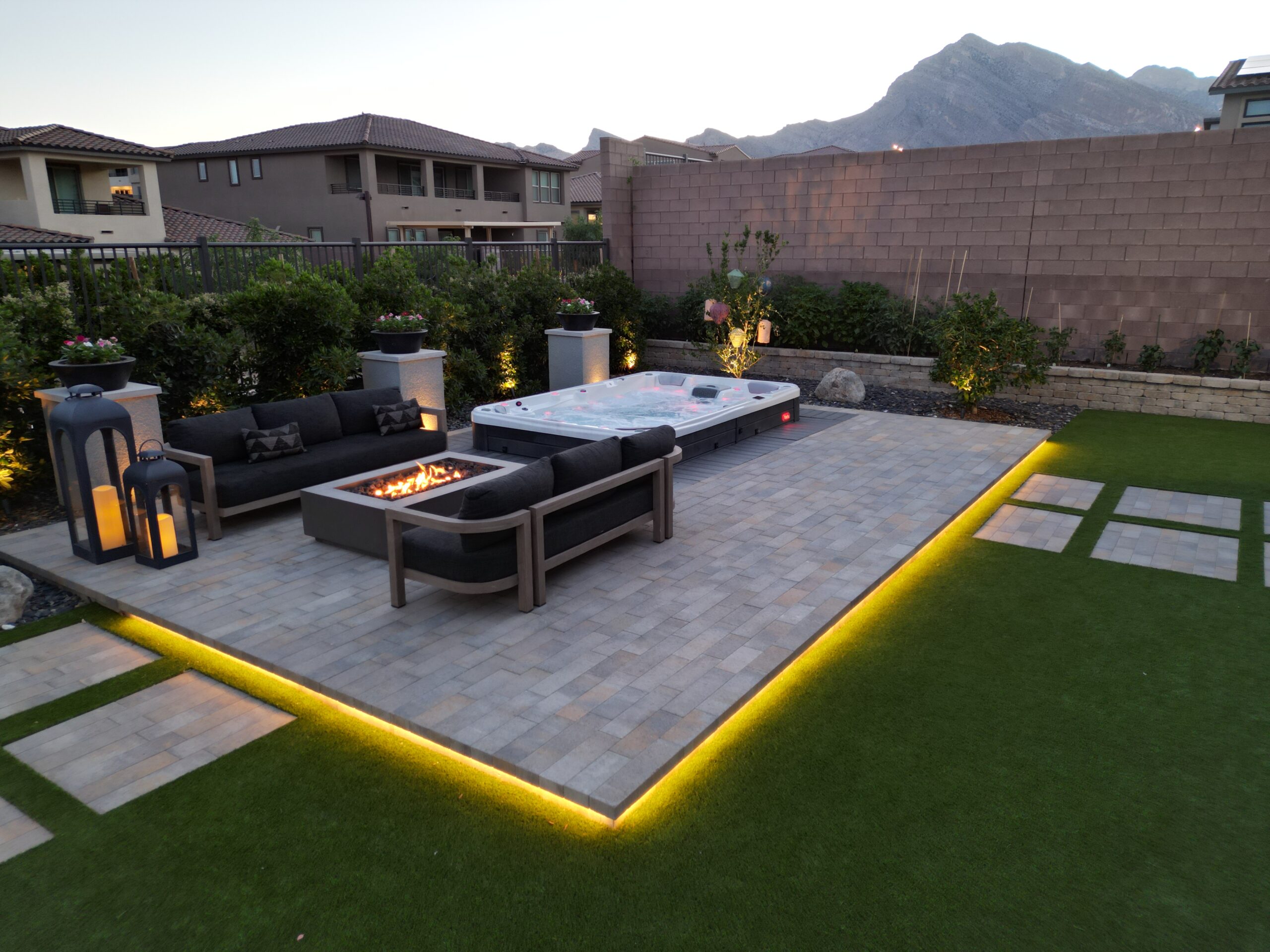 A patio with a fire pit and couch in it A patio with a fire pit and couch in it