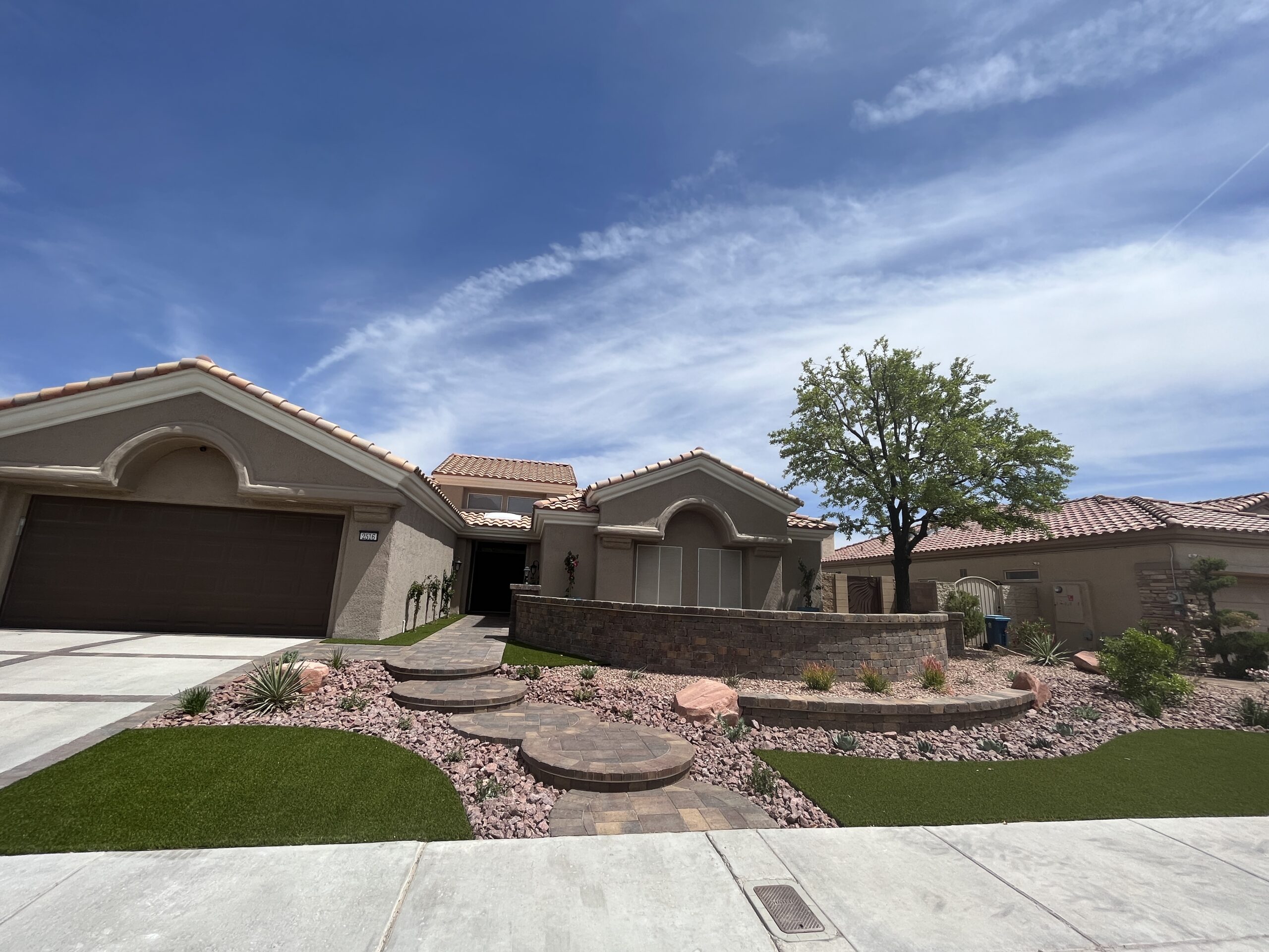 A house with a tree in the middle of it A house with a tree in the middle of it