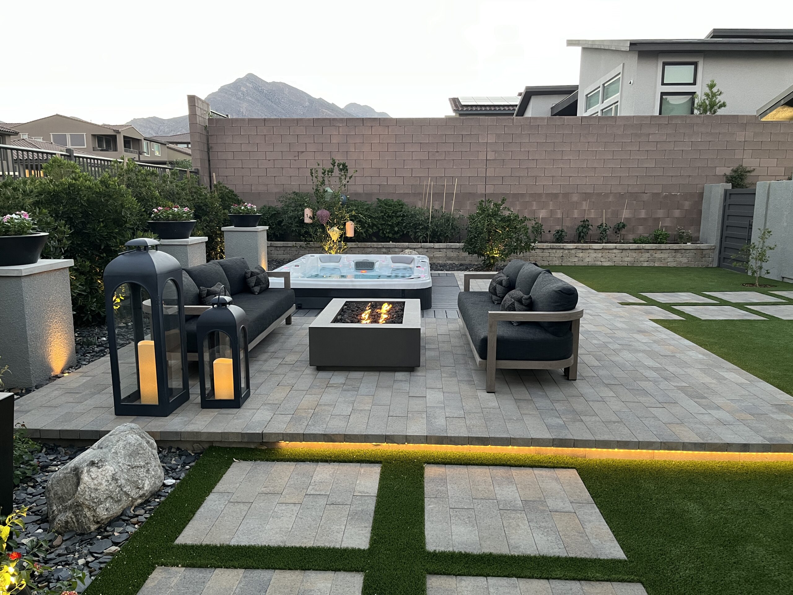 A patio with fire pit and couch set A patio with fire pit and couch set